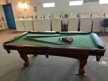 Windswept RV park with amazing amenities like pool table, TV Loune and Large washer dryer area